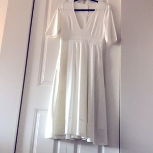 White flowy midi dress with pockets